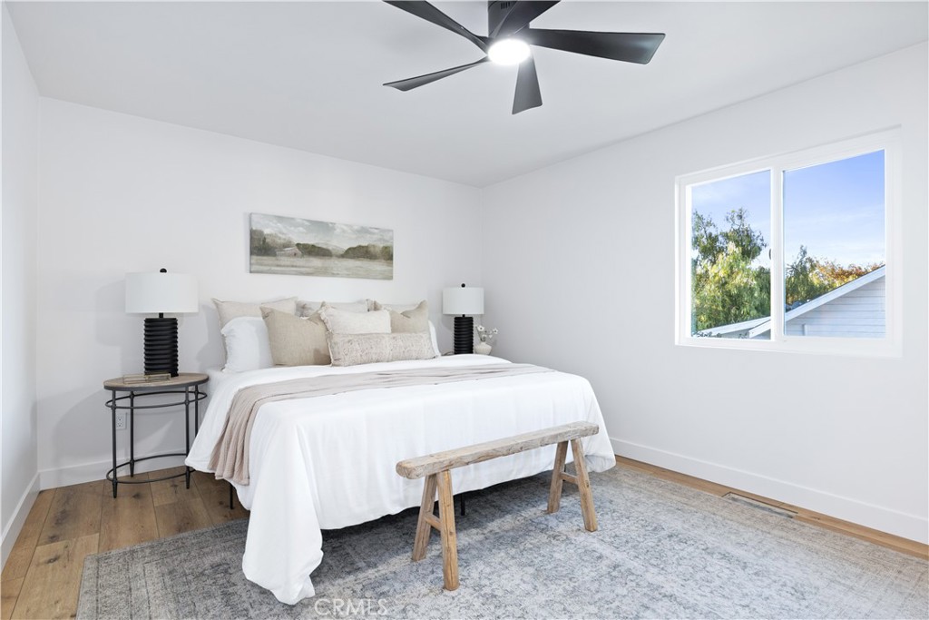 4150 Lobos Avenue Atascadero, CA 93422 - Photo 39 of 59 a bedroom with a bed and a painting on the wall