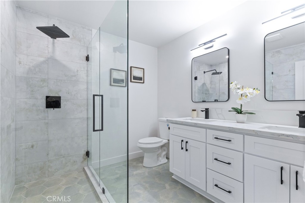 4150 Lobos Avenue Atascadero, CA 93422 - Photo 42 of 59 a bathroom with a double vanity sink toilet and shower