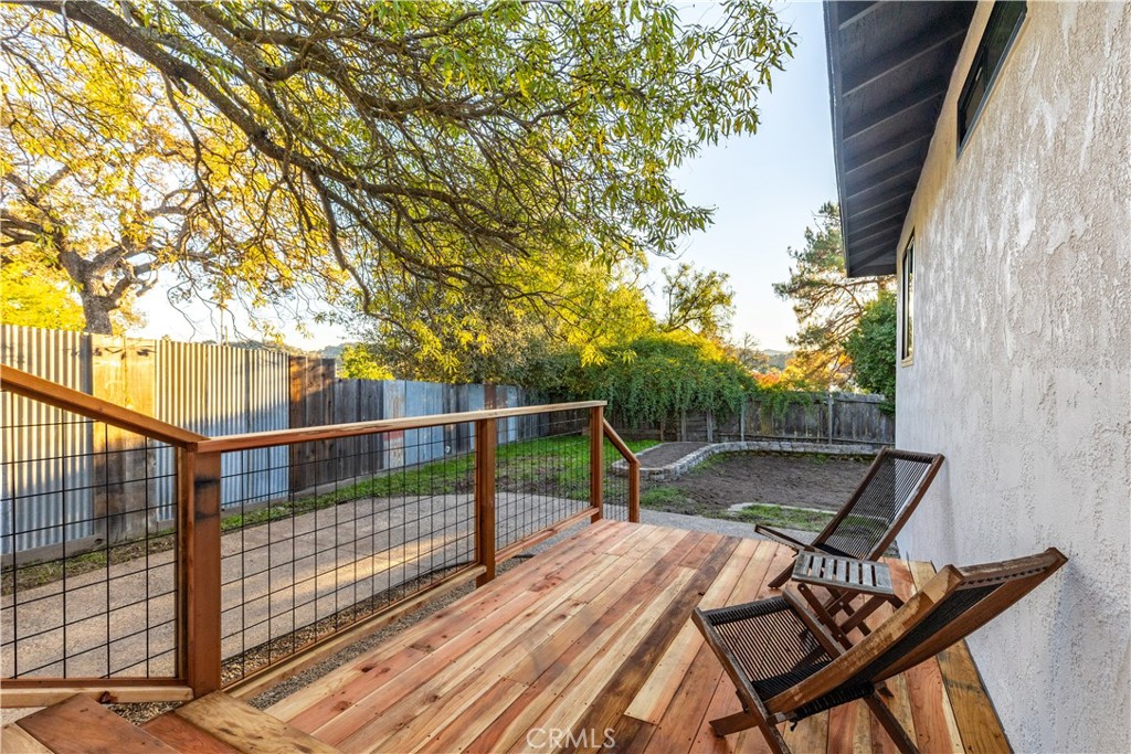 4150 Lobos Avenue Atascadero, CA 93422 - Photo 51 of 59 a view of a balcony with wooden floor and bench