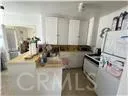 a kitchen with a sink and a mirror