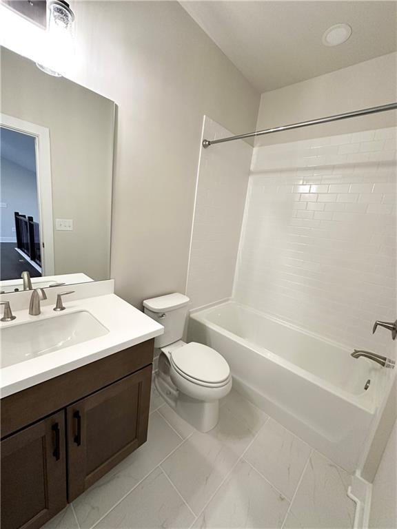 1237 Waldon Crossing Cumming, GA 30041 - Photo 25 of 29 a bathroom with a sink a toilet a mirror a bathtub and shower