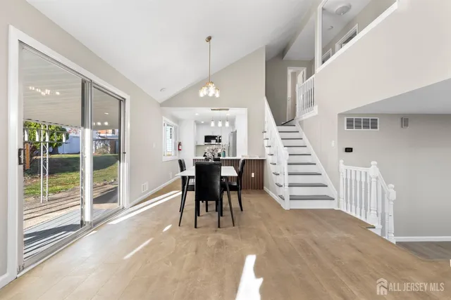 a view of dining room with furniture and entryway