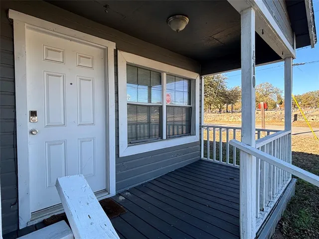 a view of front door deck and living room