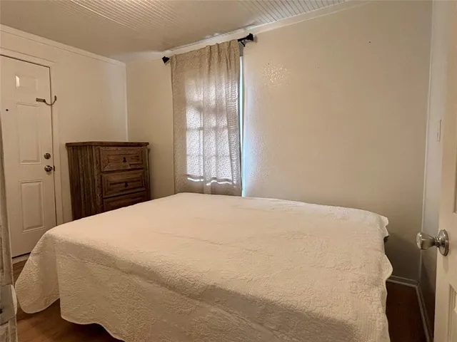 a bedroom with a bed and a closet