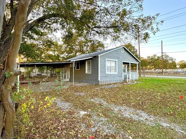 a backyard of a house with lots of green space