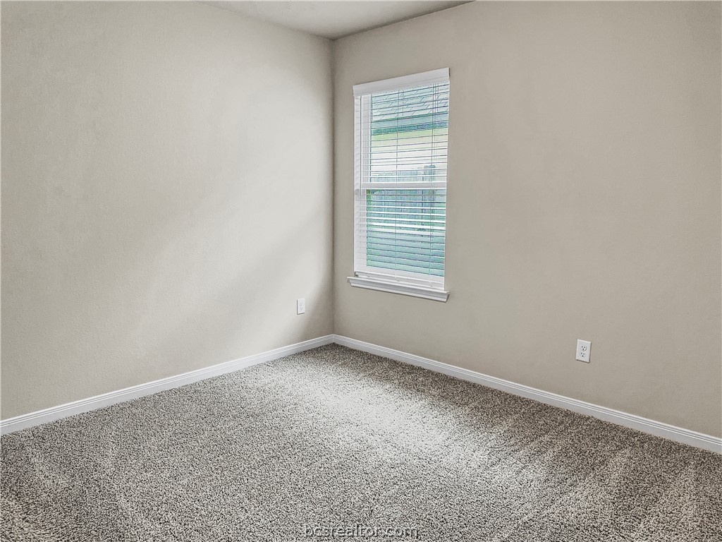 1971 Chief Street Bryan, TX 77807 - Photo 4 of 14 a view of an empty room with a window
