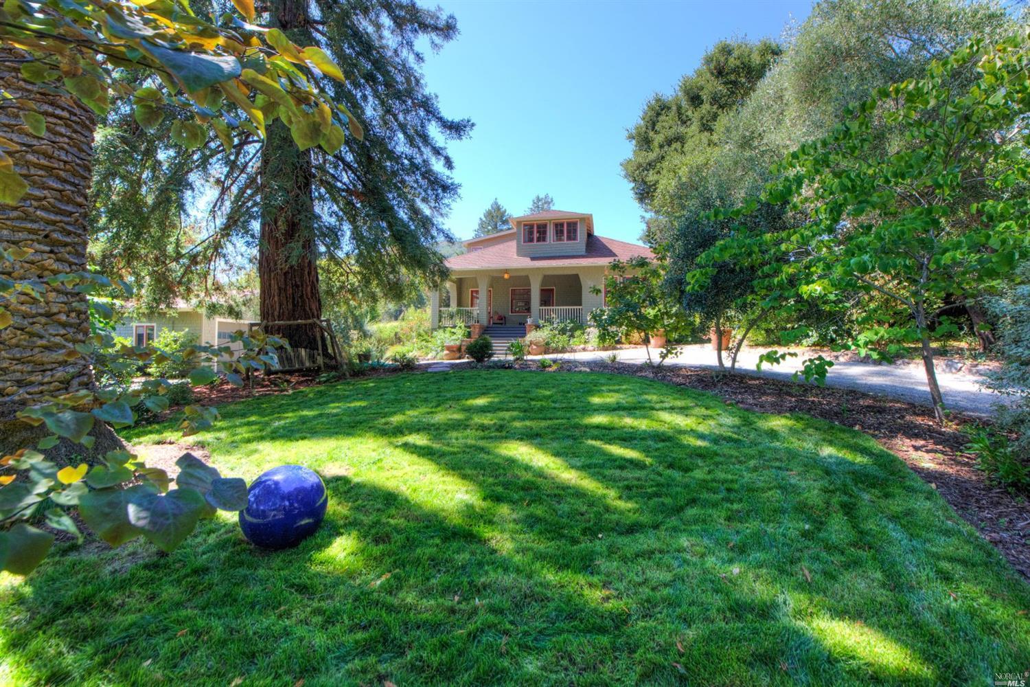 256 Crescent Road San Anselmo, CA 94960 - Photo 1 of 1 a view of a table and chairs under an umbrella