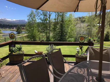a view of a chairs and table in the patio