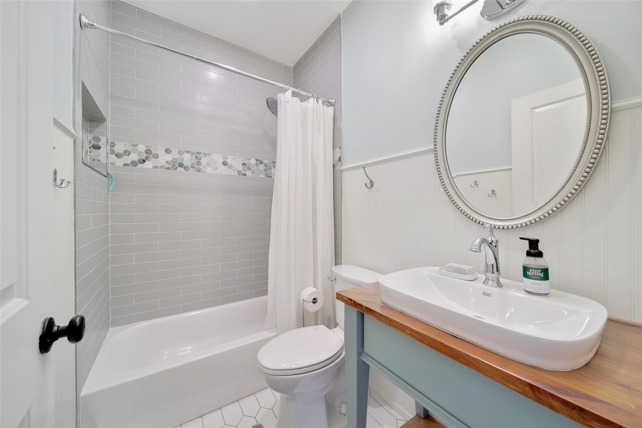 18875 Rabon Chapel Road Montgomery, TX 77316 - Photo 25 of 45 a bathroom with a sink a toilet and a mirror