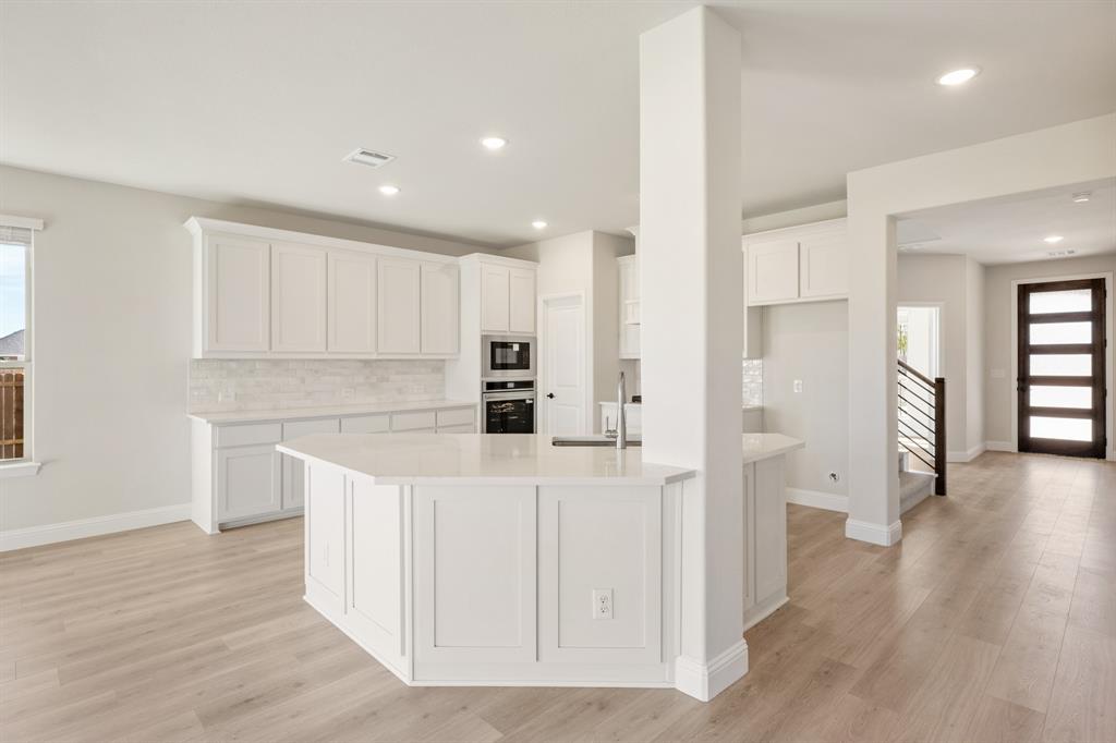 2000 Hickory Chase Lane Anna, TX 75409 - Photo 14 of 40 a kitchen with white cabinets and refrigerator