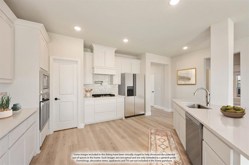2000 Hickory Chase Lane Anna, TX 75409 - Photo 15 of 40 a kitchen with refrigerator and cabinets