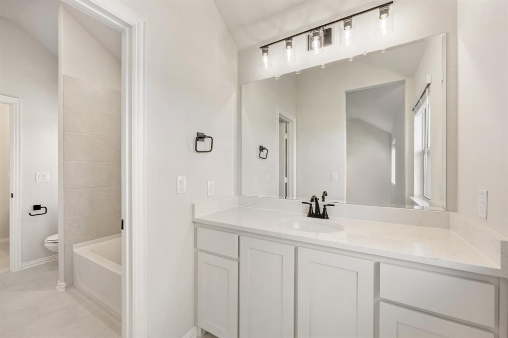 2000 Hickory Chase Lane Anna, TX 75409 - Photo 32 of 40 a bathroom with a sink a toilet and shower