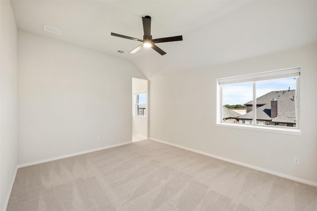 2000 Hickory Chase Lane Anna, TX 75409 - Photo 33 of 40 en empty room with window and ceiling fan