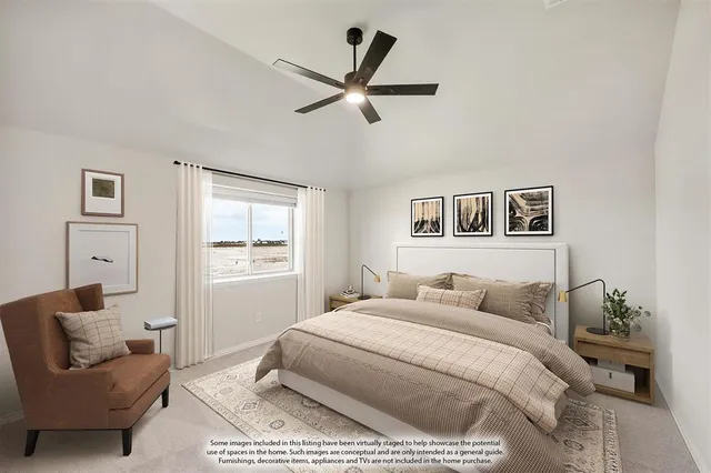 a bedroom with a bed a couch and a window