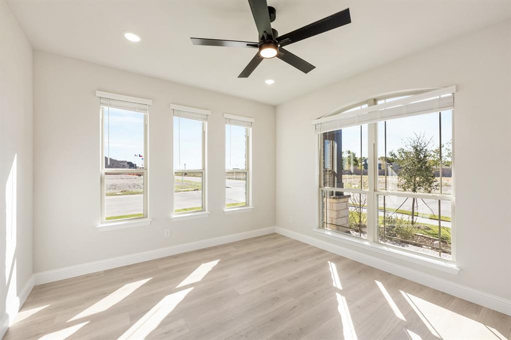 2000 Hickory Chase Lane Anna, TX 75409 - Photo 5 of 40 a view of an empty room with a window and a ceiling fan