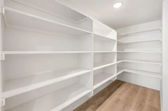 a view of a room with storage and racks on wall