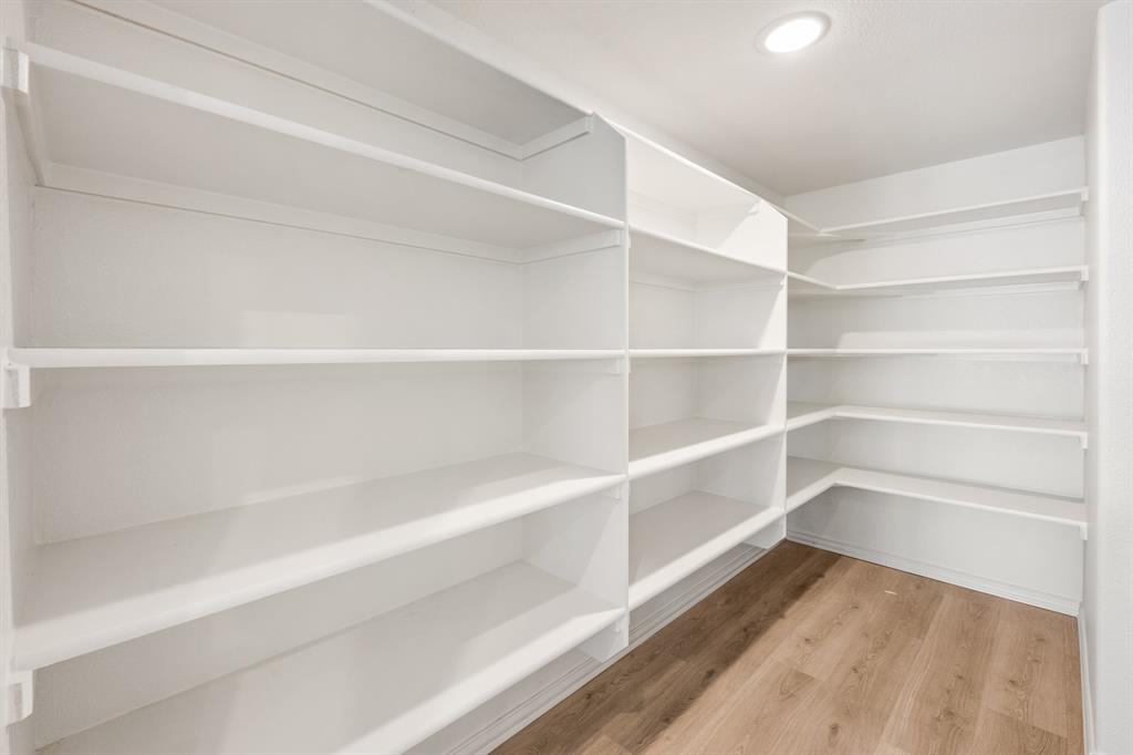 2000 Hickory Chase Lane Anna, TX 75409 - Photo 9 of 40 a view of a room with storage and racks on wall