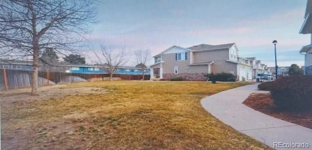a swimming pool with outdoor seating and yard