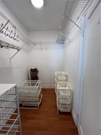 a view of room with stairs and wooden floor