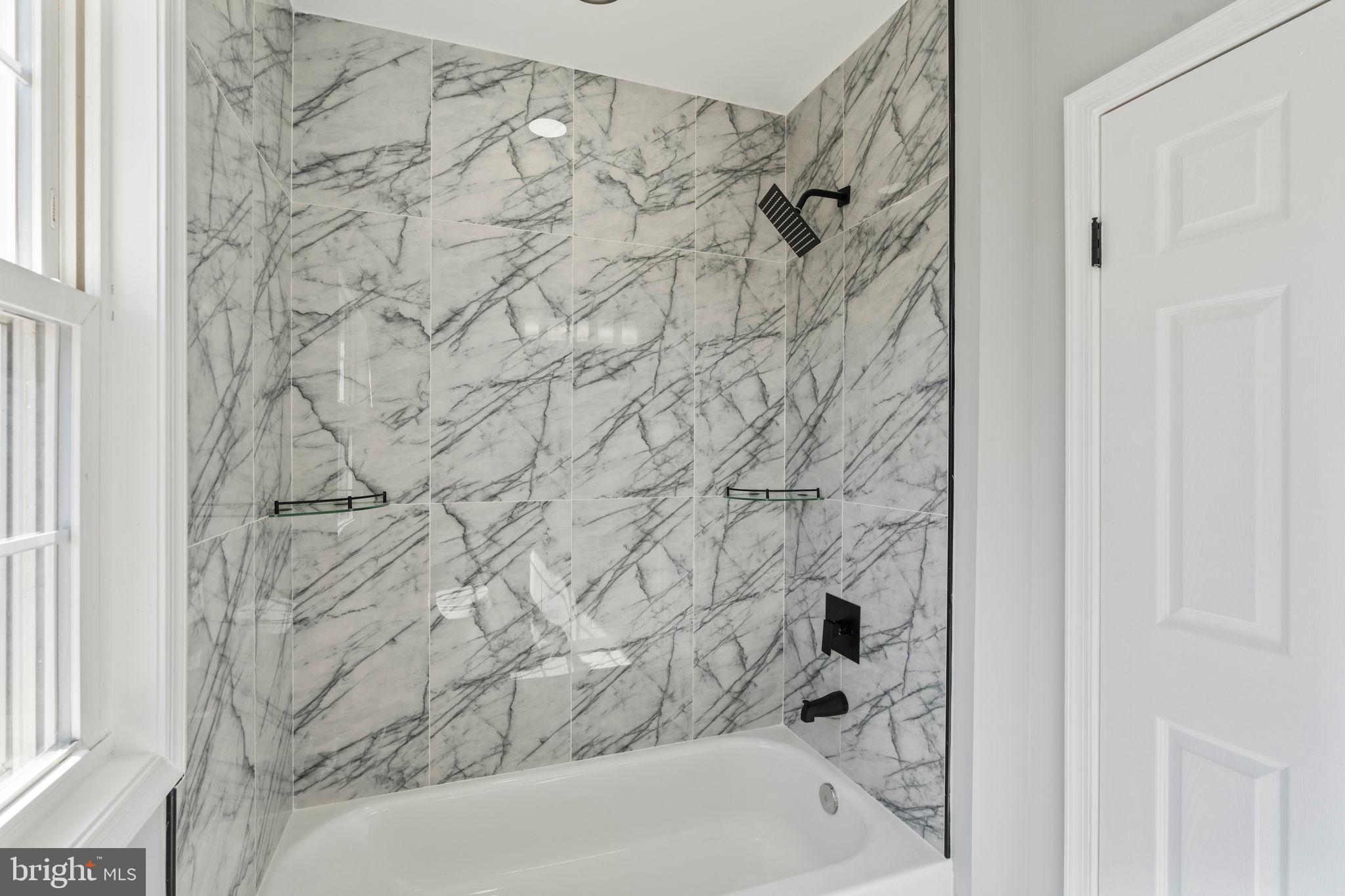 402 Croydon Road Baltimore, MD 21212 - Photo 27 of 56 Gleaming ceramic tile in tub shower