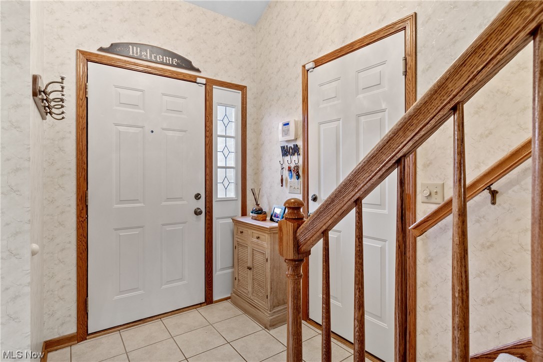 2428 Charing Cross Road Northwest Canton, OH 44708 - Photo 2 of 35 Foyer entrance. Doors leading to front porch & garage.
