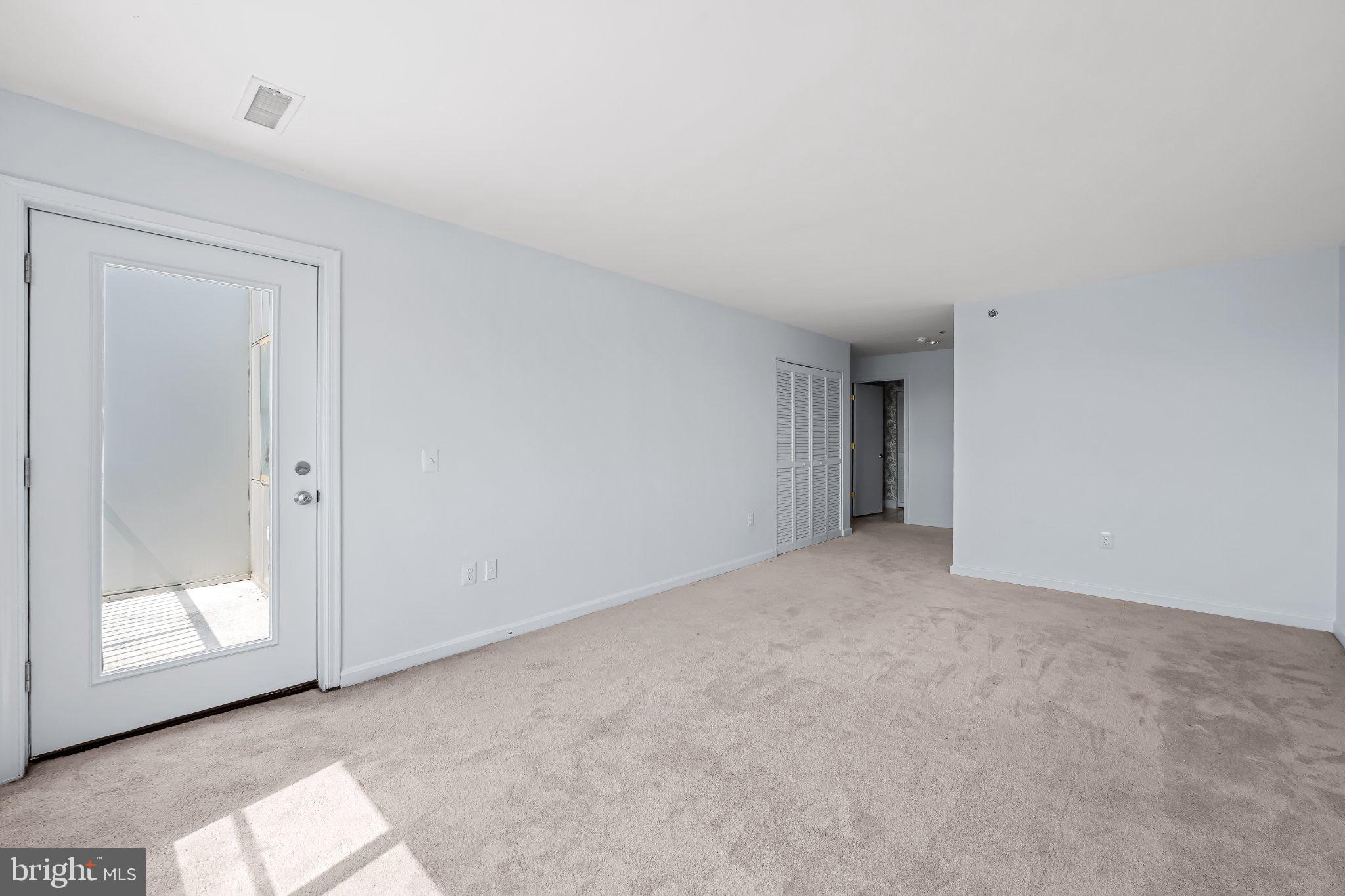 2702 Lighthouse Point East, Unit 738 Baltimore, MD 21224 - Photo 29 of 33 Spacious, light-filled living area.