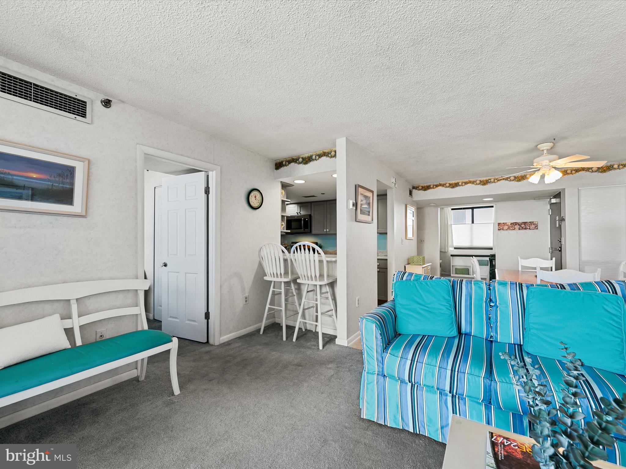 311 Georgetown House Bethany Beach, DE 19930 - Photo 11 of 48 a living room with furniture and a table