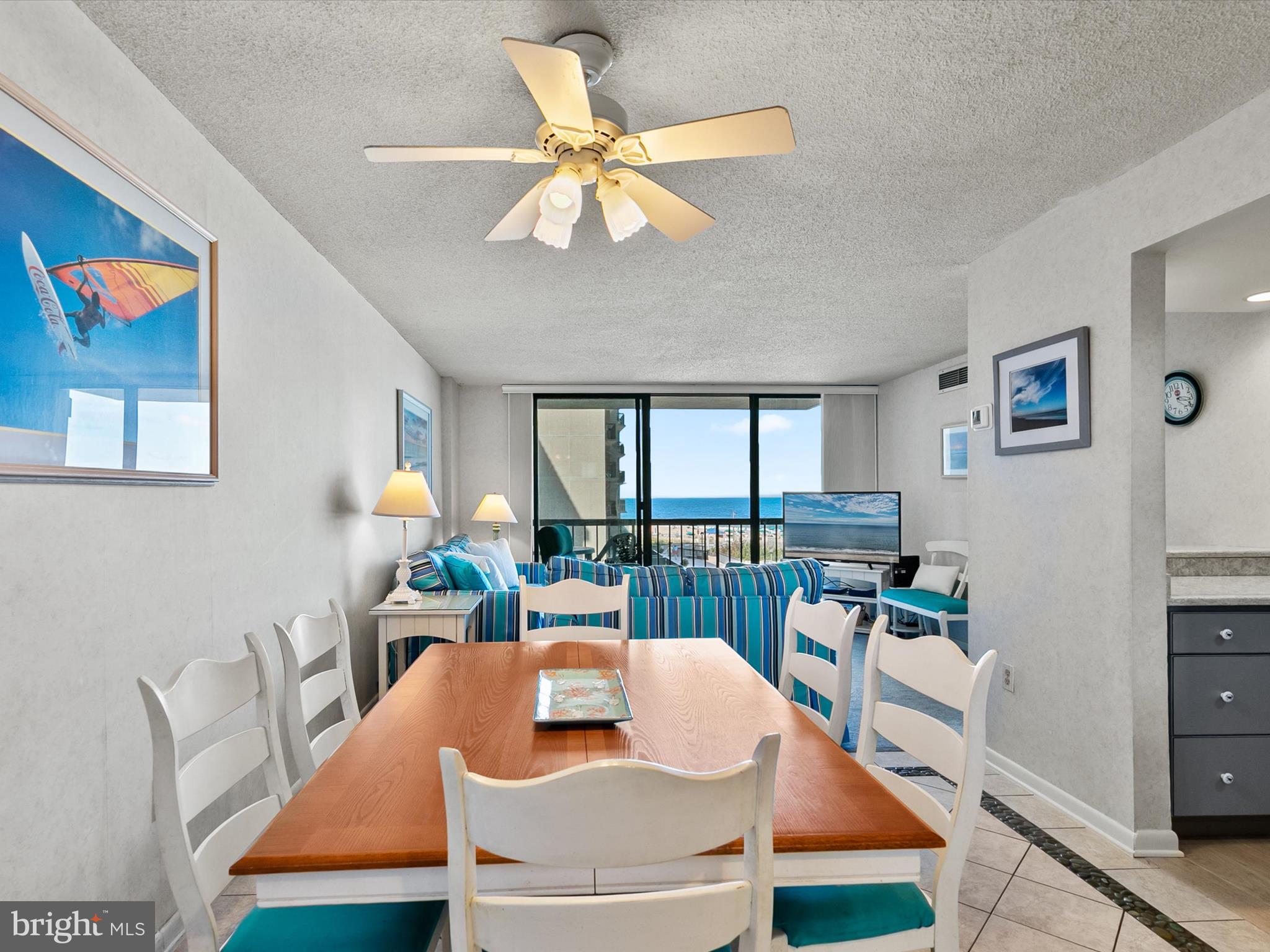 311 Georgetown House Bethany Beach, DE 19930 - Photo 13 of 48 a living room with furniture a flat screen tv and a large window