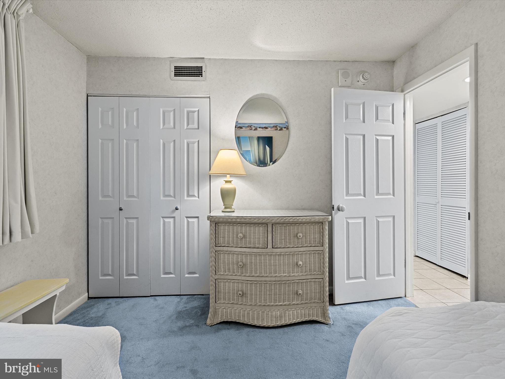 311 Georgetown House Bethany Beach, DE 19930 - Photo 24 of 48 a bedroom with a bed and a dresser