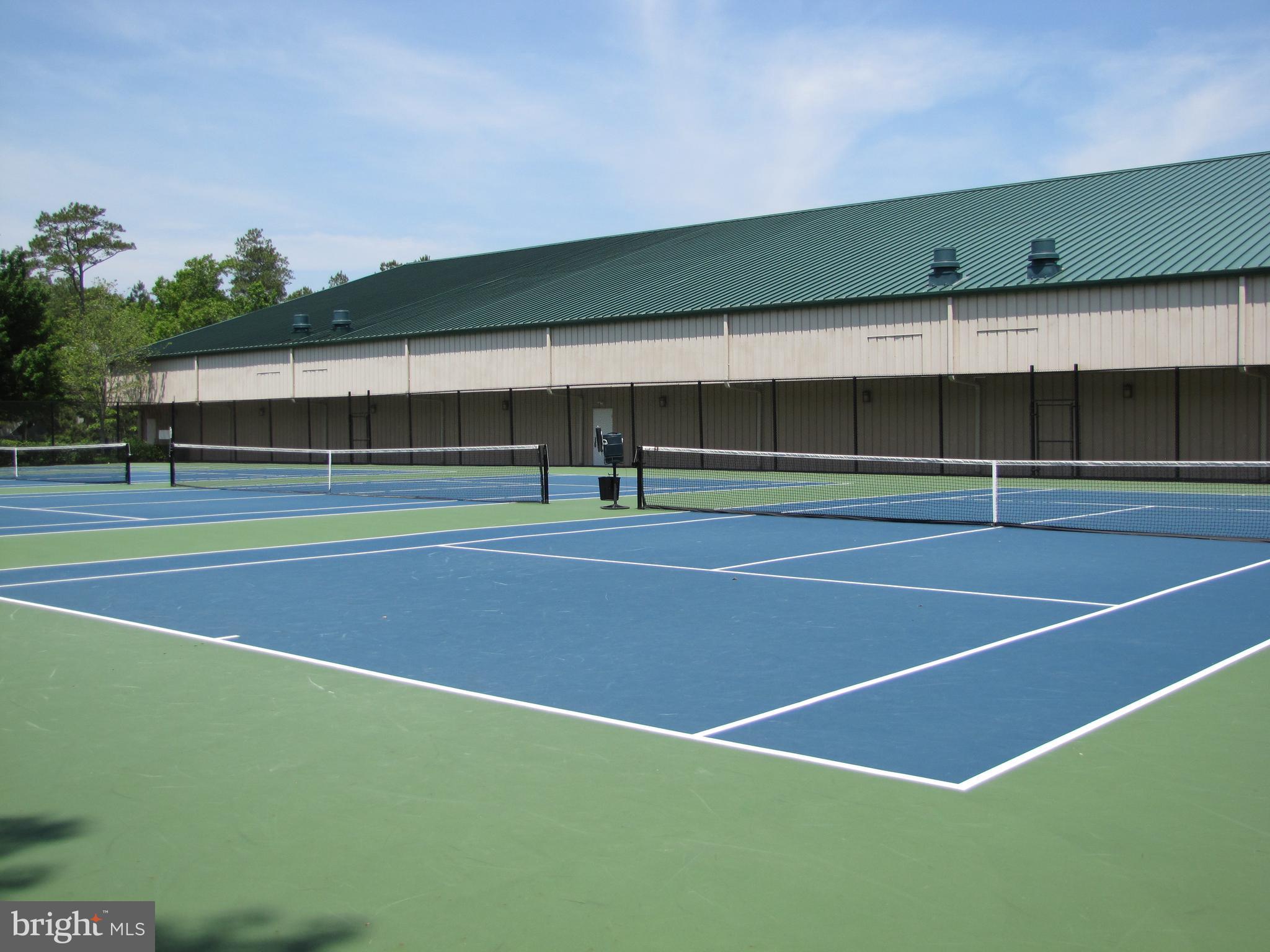 311 Georgetown House Bethany Beach, DE 19930 - Photo 29 of 48 a view of an outdoor space and tennis court
