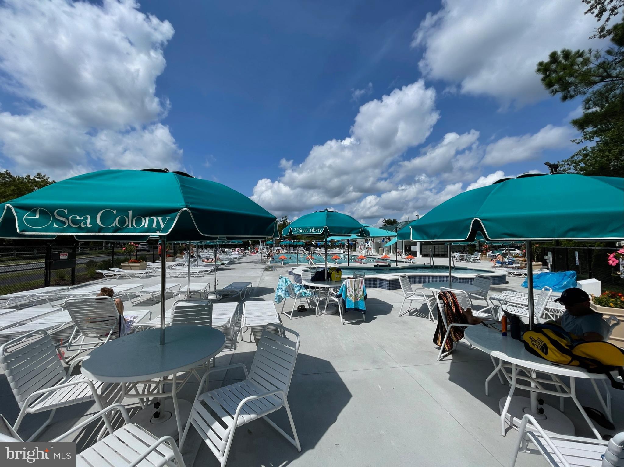 311 Georgetown House Bethany Beach, DE 19930 - Photo 35 of 48 a view of a chairs and table in a patio