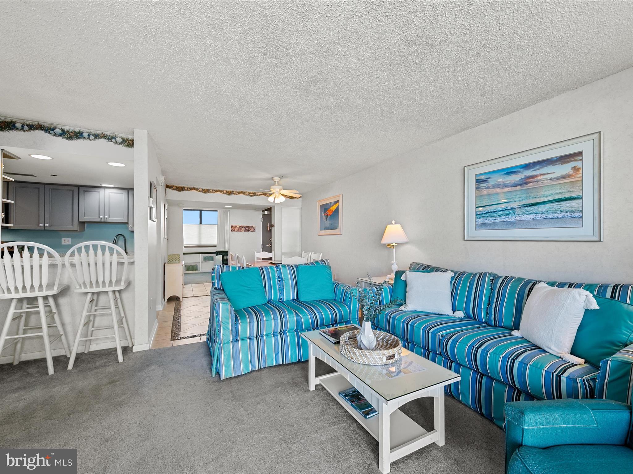 311 Georgetown House Bethany Beach, DE 19930 - Photo 10 of 48 a living room with furniture and a lamp
