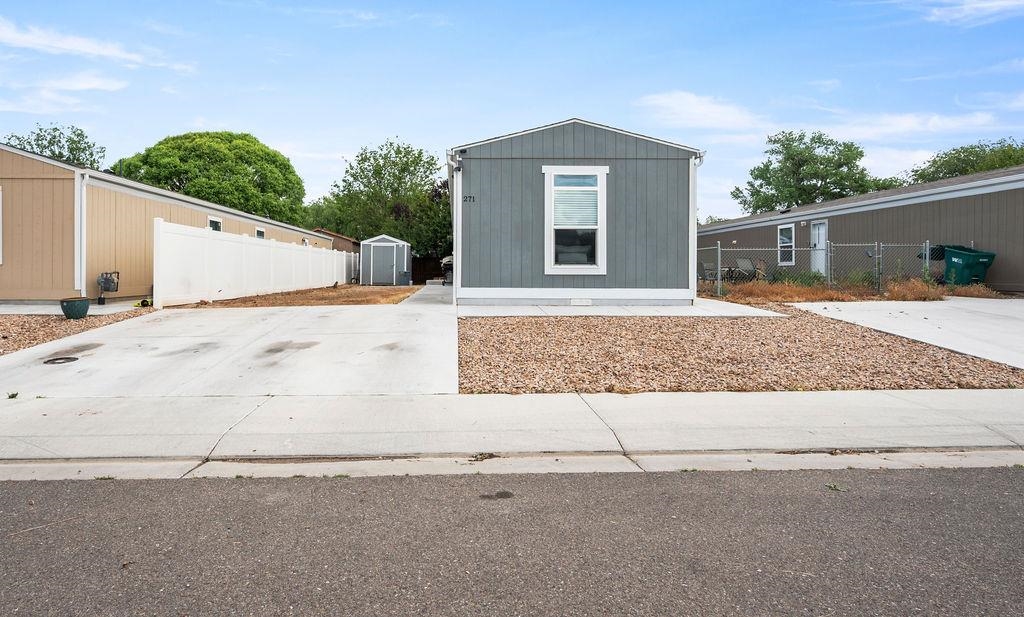 271 Clements Way Fruita, CO 81521 - Photo 25 of 26 front view of a house with a yard
