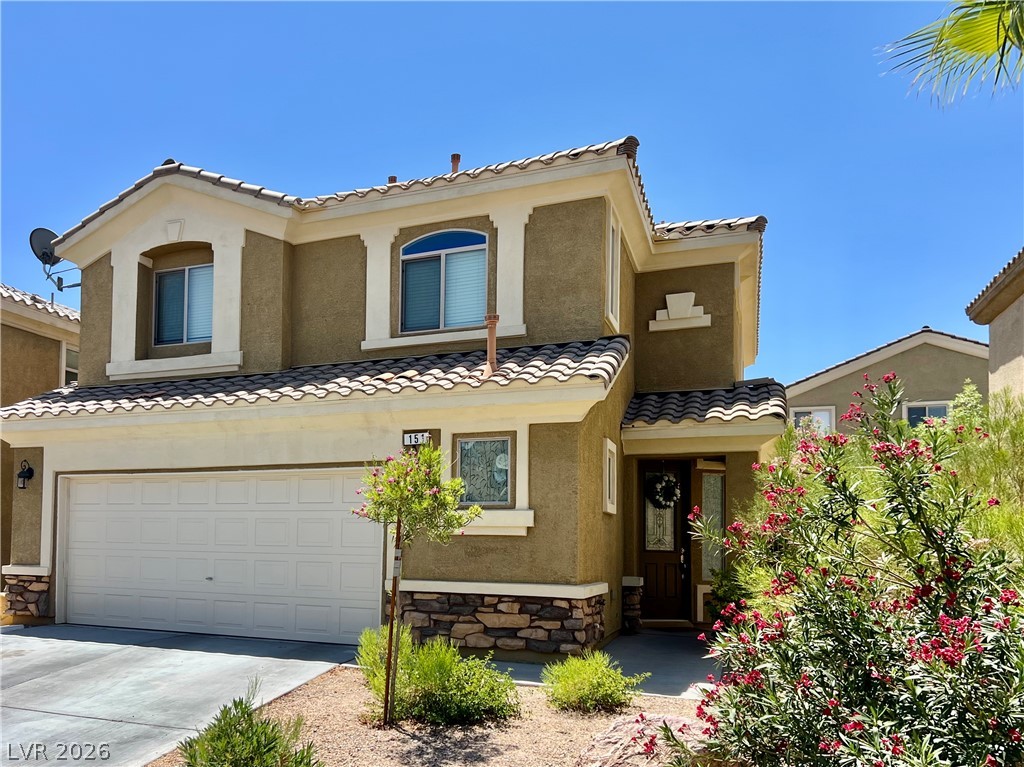151 Short Ruff Way Las Vegas, NV 89148 - Photo 15 of 17 A classic stucco exterior pairs with stone accents and a tiled roof under blue skies.