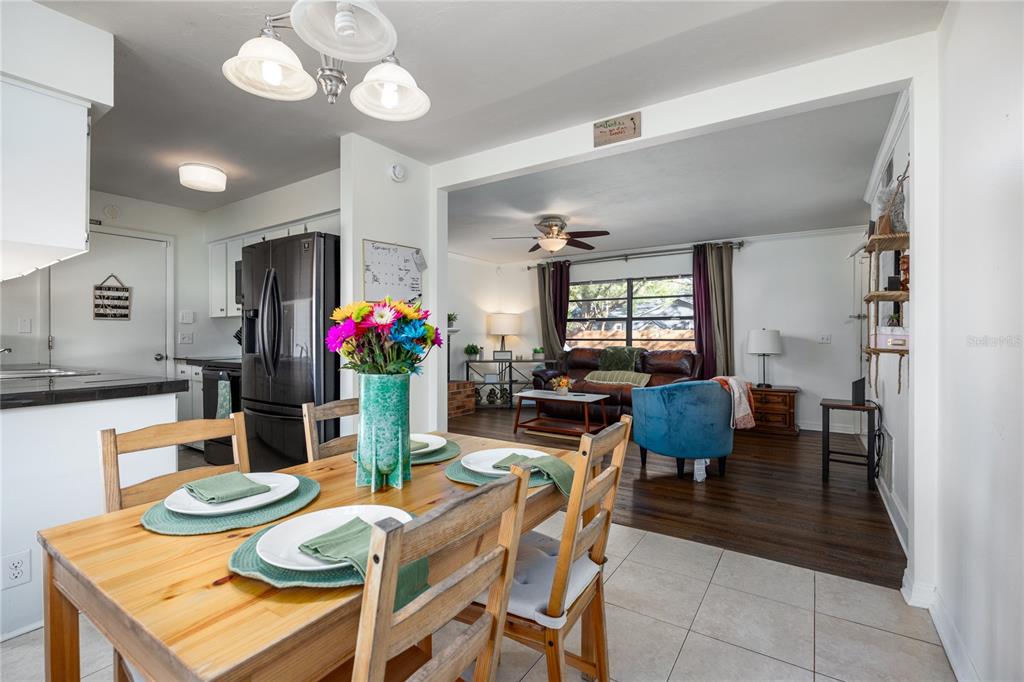 8031 Southwest 13th Road Gainesville, FL 32607 - Photo 12 of 40 a view of a dining room with furniture and a chandelier