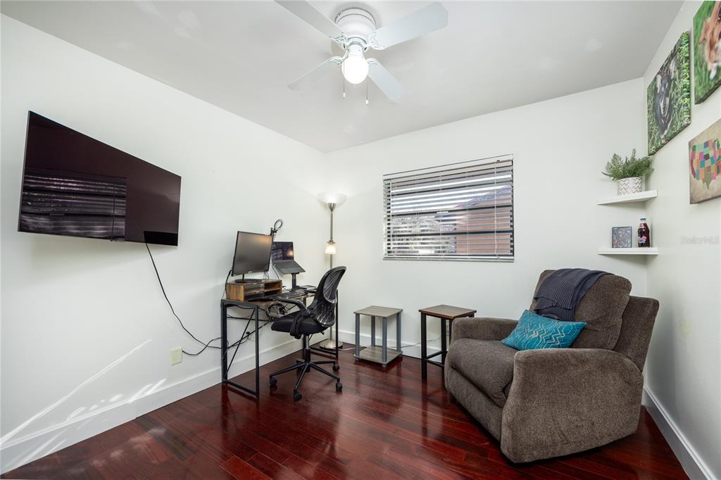 8031 Southwest 13th Road Gainesville, FL 32607 - Photo 22 of 40 a living room with furniture and a flat screen tv