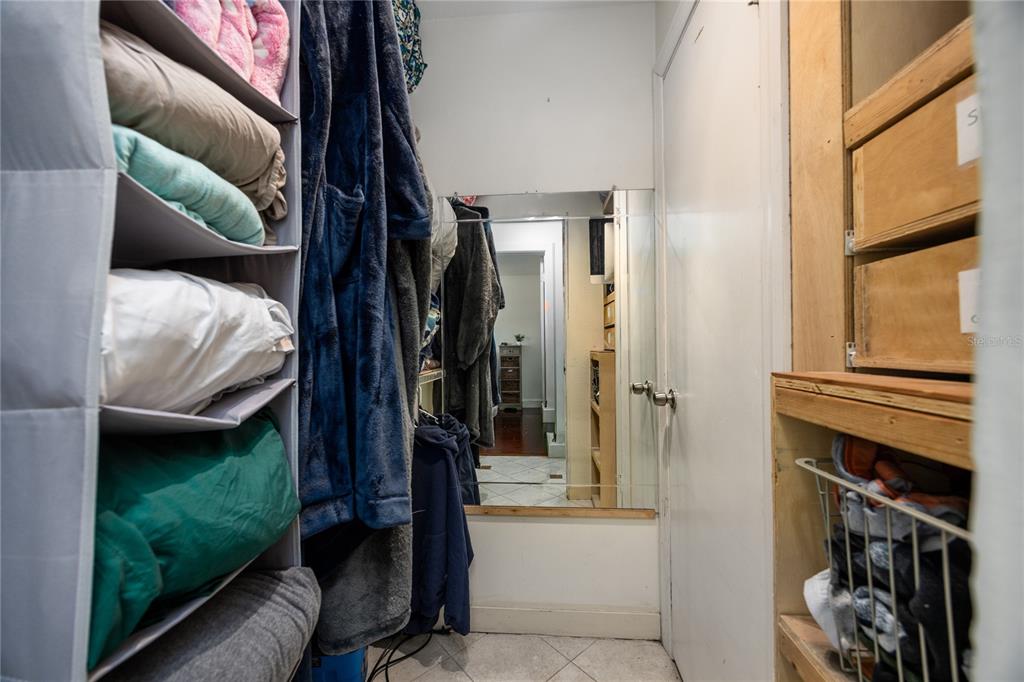 8031 Southwest 13th Road Gainesville, FL 32607 - Photo 24 of 40 a view of walk in closet with clothes and shoes