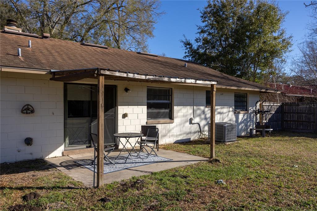 8031 Southwest 13th Road Gainesville, FL 32607 - Photo 27 of 40 a view of a house with backyard