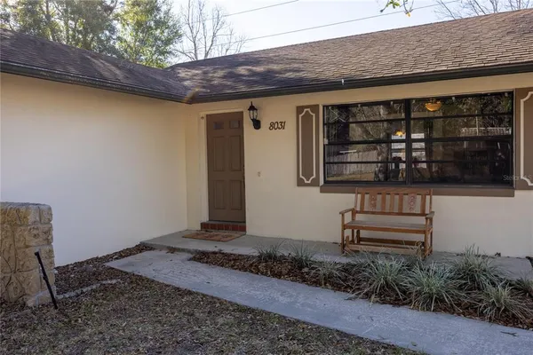 a view of a door and wooden floor