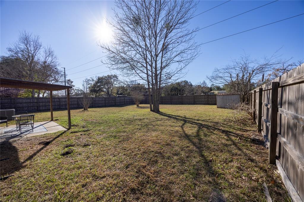 8031 Southwest 13th Road Gainesville, FL 32607 - Photo 32 of 40 a view of backyard with wooden fence