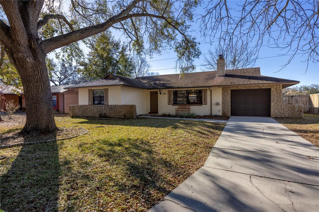 8031 Southwest 13th Road Gainesville, FL 32607 - Photo 39 of 40 a front view of a house with a yard
