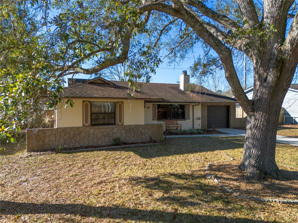 8031 Southwest 13th Road Gainesville, FL 32607 - Photo 40 of 40 a front view of a house with a garden
