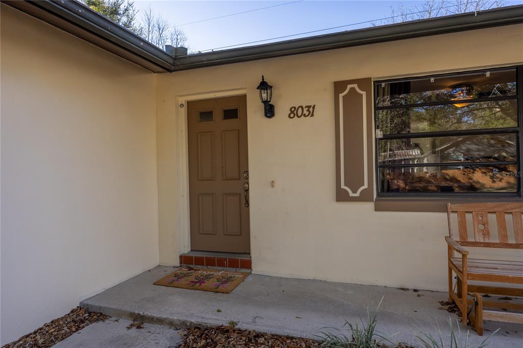 8031 Southwest 13th Road Gainesville, FL 32607 - Photo 4 of 40 a view of a door and wooden floor