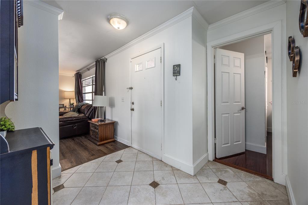 8031 Southwest 13th Road Gainesville, FL 32607 - Photo 6 of 40 a living room with furniture and a large mirror