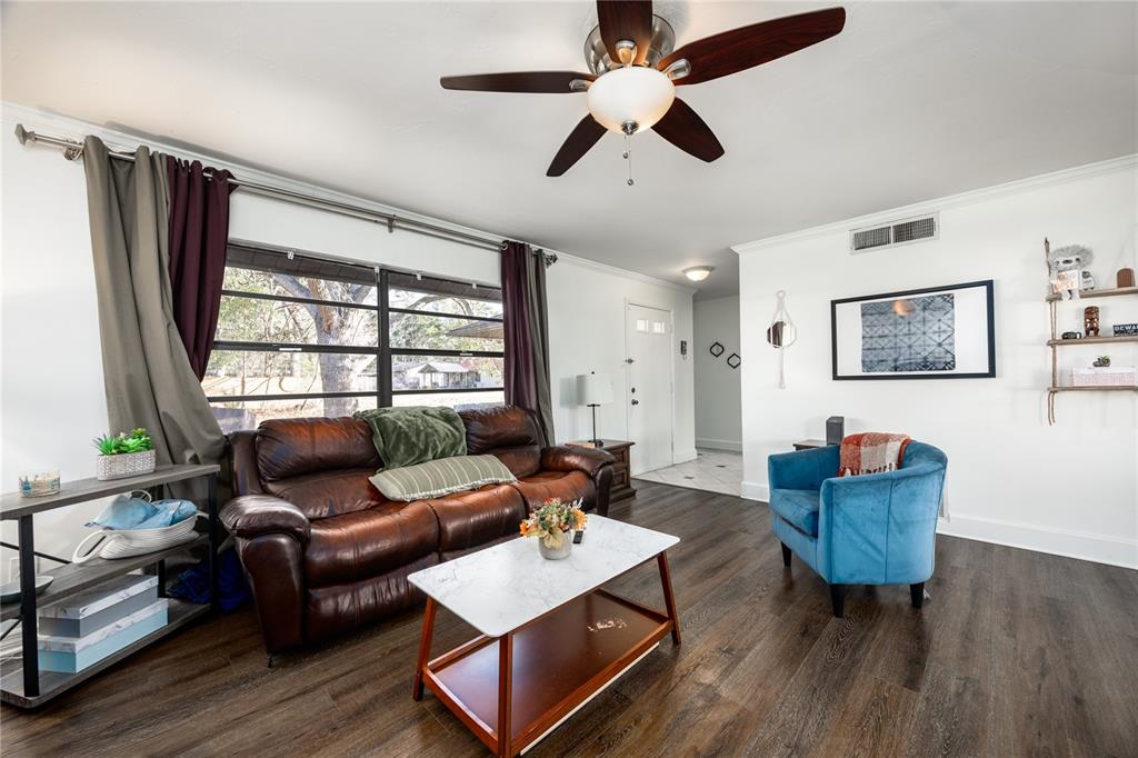 8031 Southwest 13th Road Gainesville, FL 32607 - Photo 9 of 40 a living room with furniture and a window