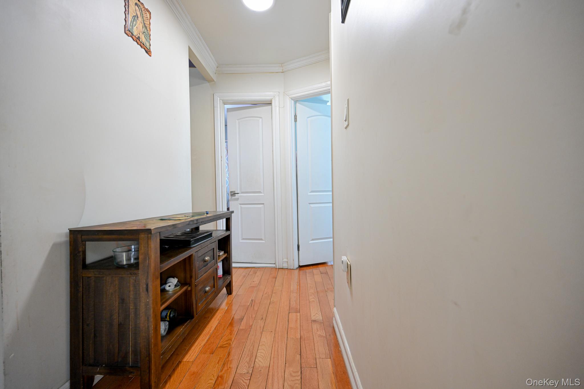 176-25 133rd Road Queens, NY 11434 - Photo 12 of 15 a view of a kitchen with wooden floor and cabinets