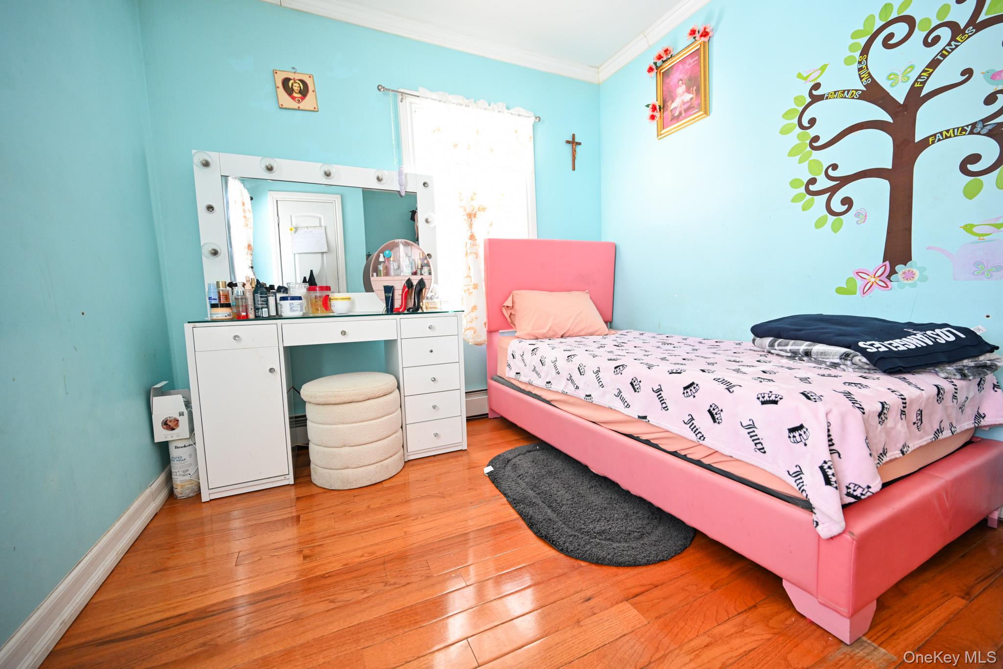 176-25 133rd Road Queens, NY 11434 - Photo 14 of 15 a bedroom with a bed and a table