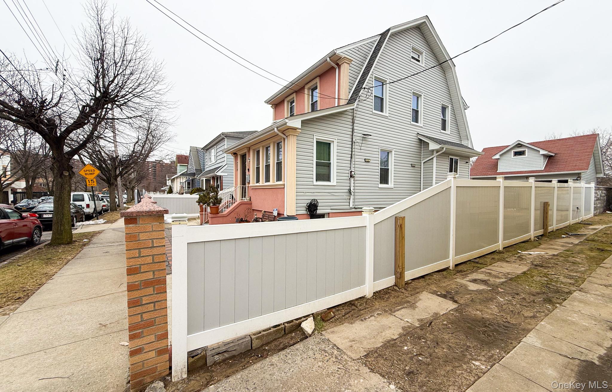 176-25 133rd Road Queens, NY 11434 - Photo 2 of 15 a view of a white house with a large park next to a road