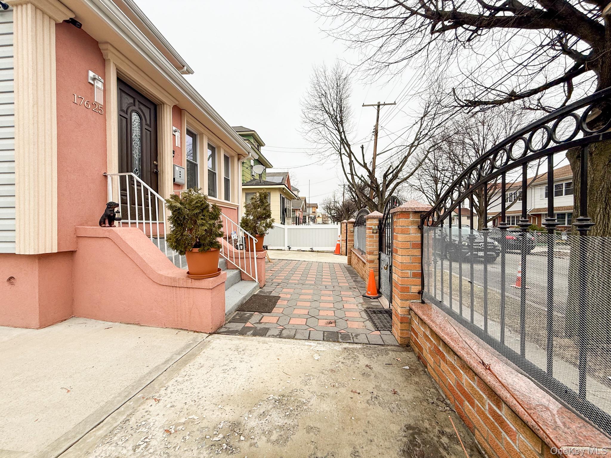 176-25 133rd Road Queens, NY 11434 - Photo 4 of 15 a view of a pathway with a backyard