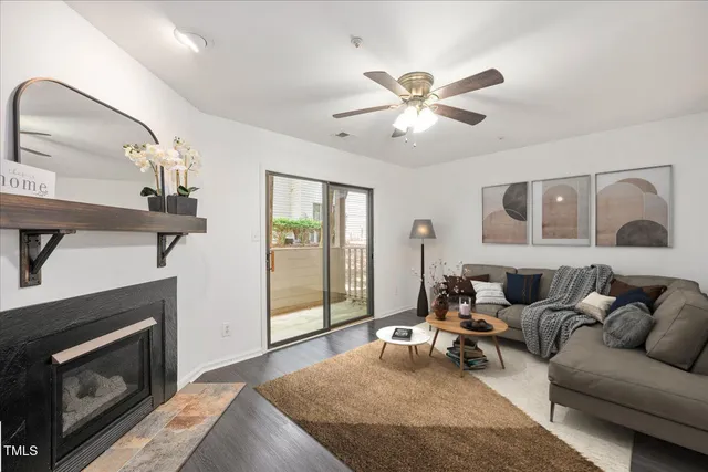 a living room with furniture and a fireplace